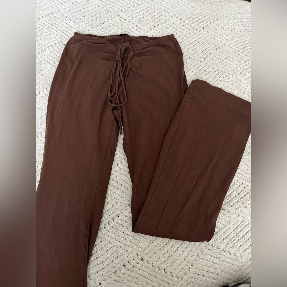 brown flared pants with a detailed front
